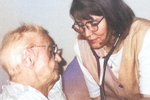 Doctor providing a house call at patient's home