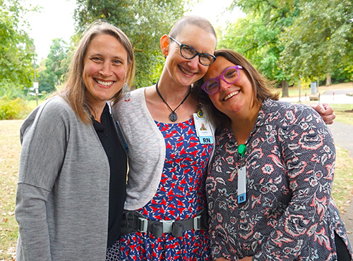 Housecall Providers employees smile for a picture at the park